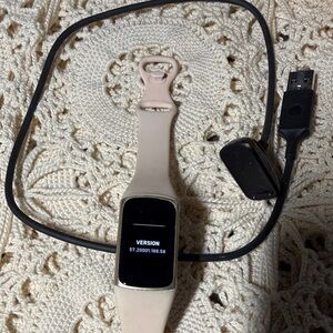 Elegant Fitbit Smartwatch with pink Band